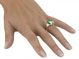 Anillo de tres piedras con esmeralda verde de 5,31 ct y piedras trapezoidales laterales